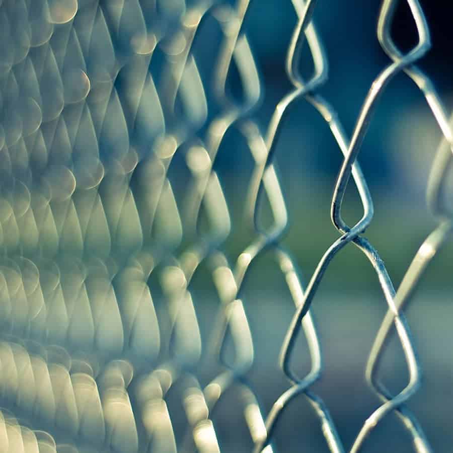 Abstract image for Website Security image showing meshed fence